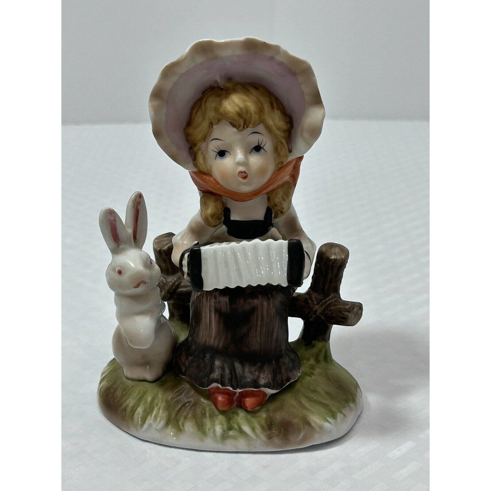 Vintage Porcelain Girl On Fence Playing Accordion with Bunny Rabbit Figurine